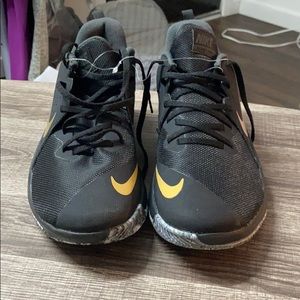 Nike black men’s with the Nike gold emblem new
